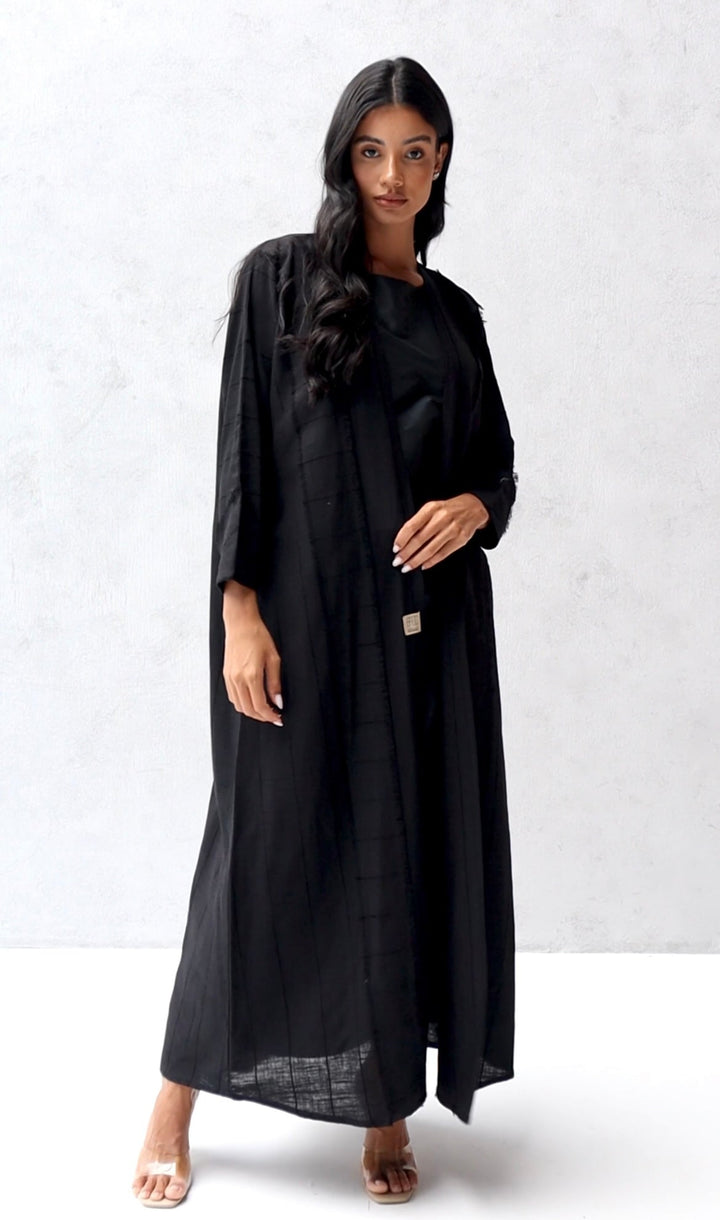 Basic 04 Four Black Stripped Linen Abaya ready to wear look 1 by BASIC ABAYA DUBAI