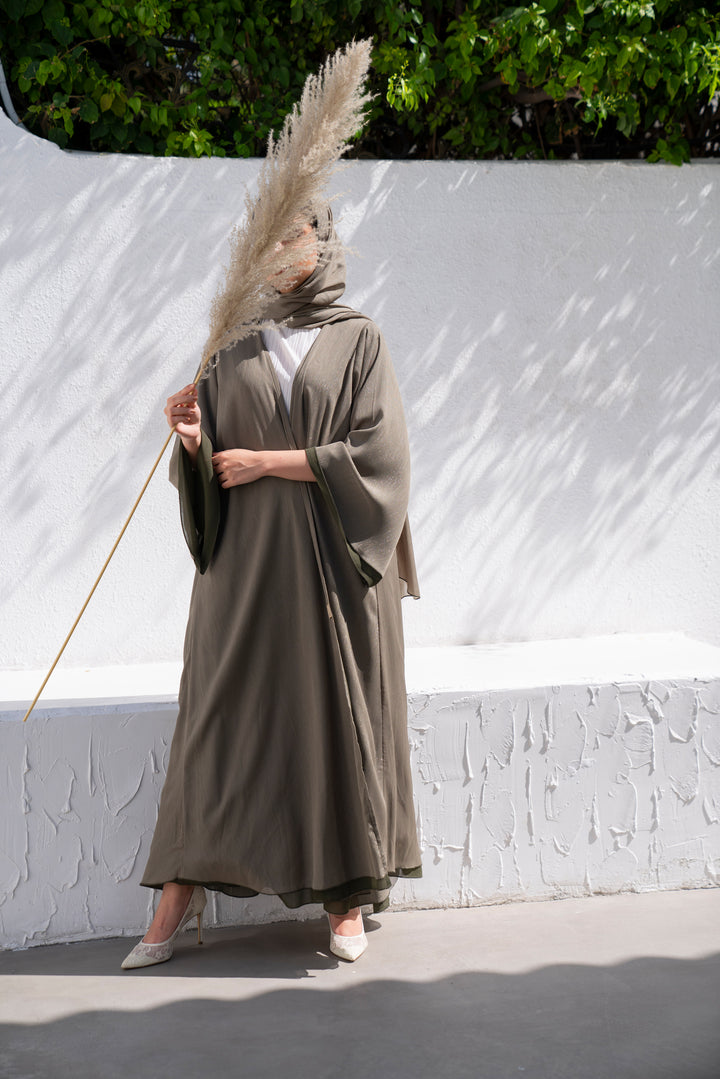 Basic 10 Ten Green Abaya look 1 from the LATEST ONLINE DUBAI ABAYAS COLLECTION